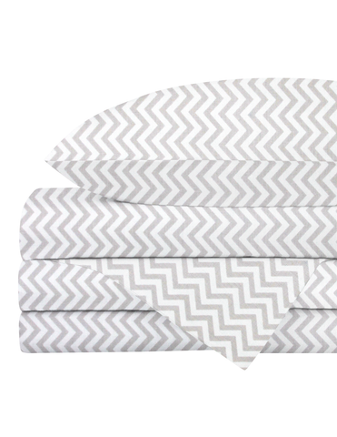 Cuna de 130x70 con la sábana de cajón Nap Baby Chevron Gris de algodón bien ajustada, la encimera doblada a los pies y la funda a juego.