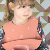 Babero de Silicón para Bebé con bolsa atrapa comida - Palo Rosa Estampado